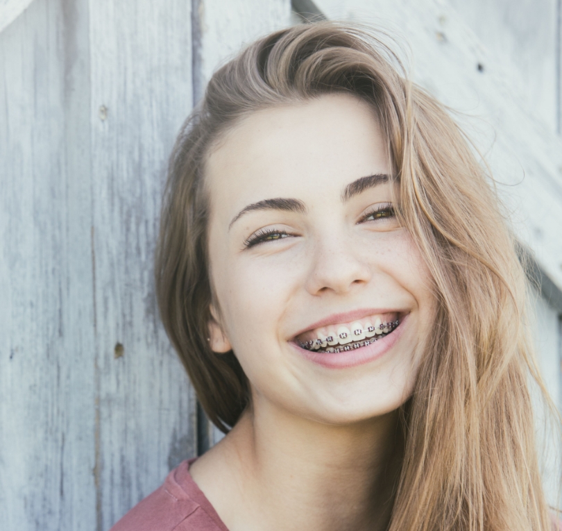 young teen girl with braces