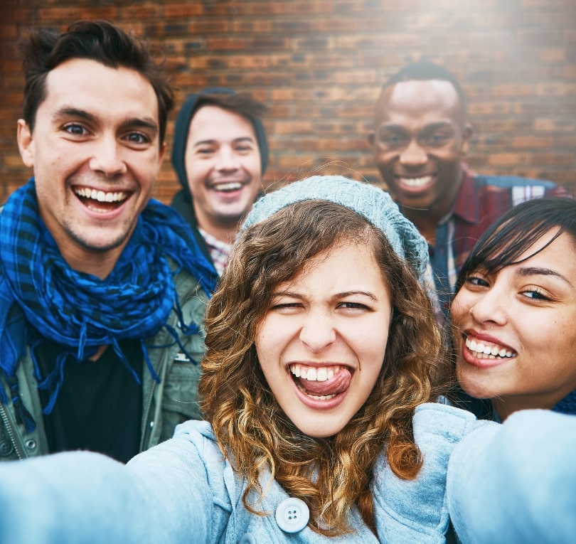 group of friends hamming it up for a selfie